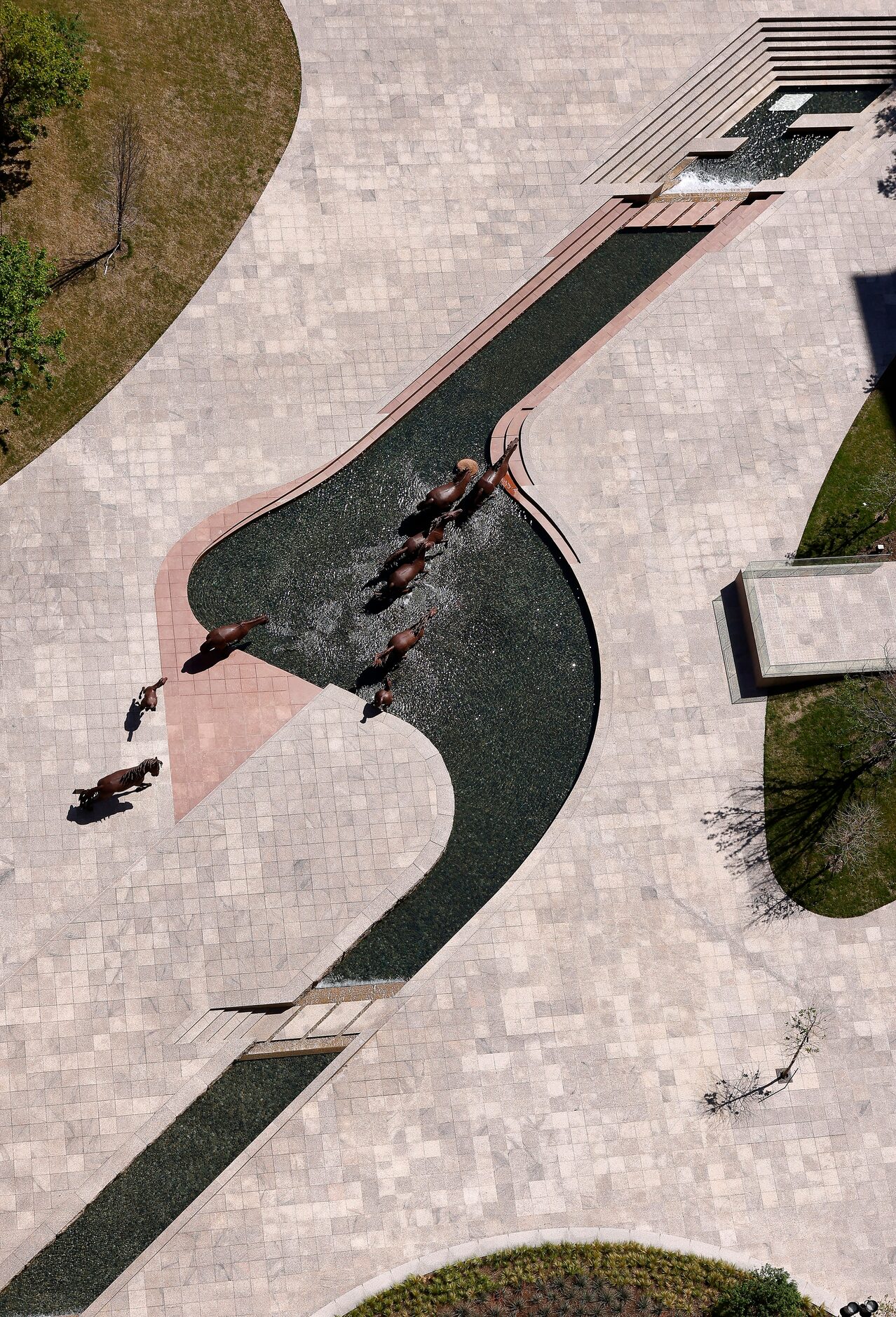 The Mustangs of Las Colinas sculpture is viewed from atop The Towers at Williams Square in...