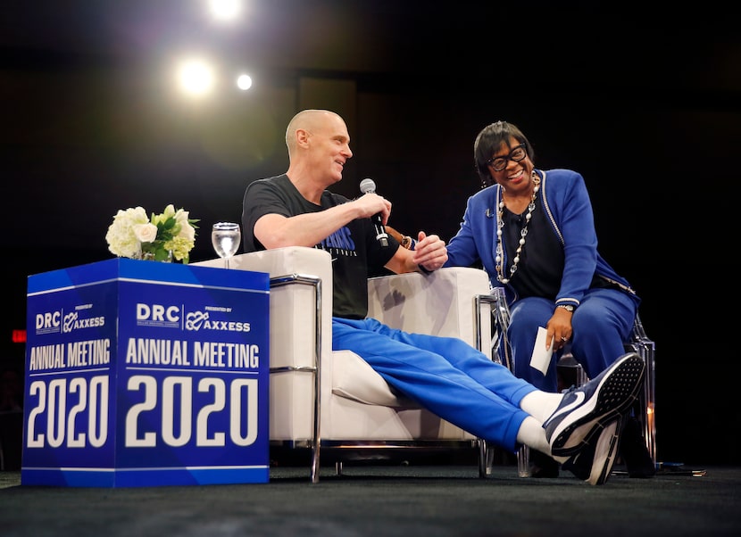 Dallas Mavericks CEO Cynt Marshall (right) laughs at team head coach Rick Carlisle as they...