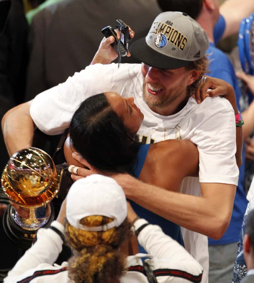 FILE - Dirk Nowitzki embraces Jessica after winning series-clinching Game 6 of the NBA...