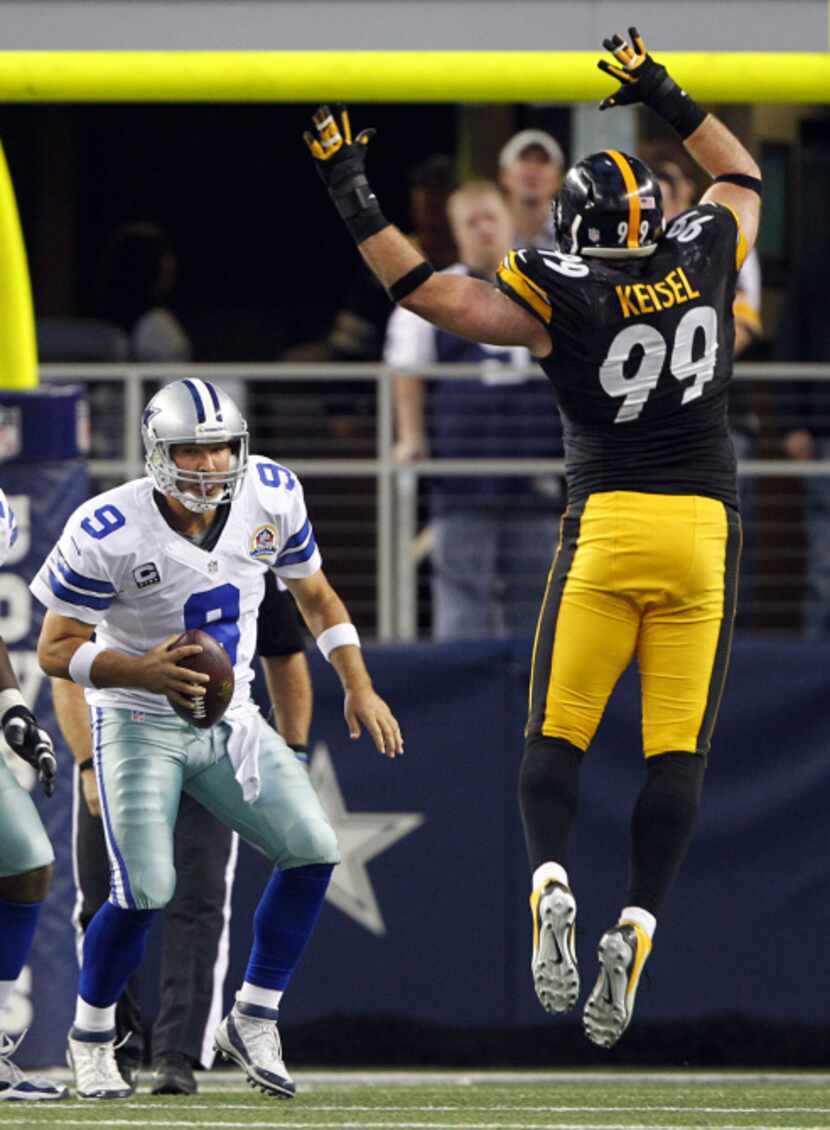 Dallas Cowboys quarterback Tony Romo (9) looks for another way out as Pittsburgh Steelers...