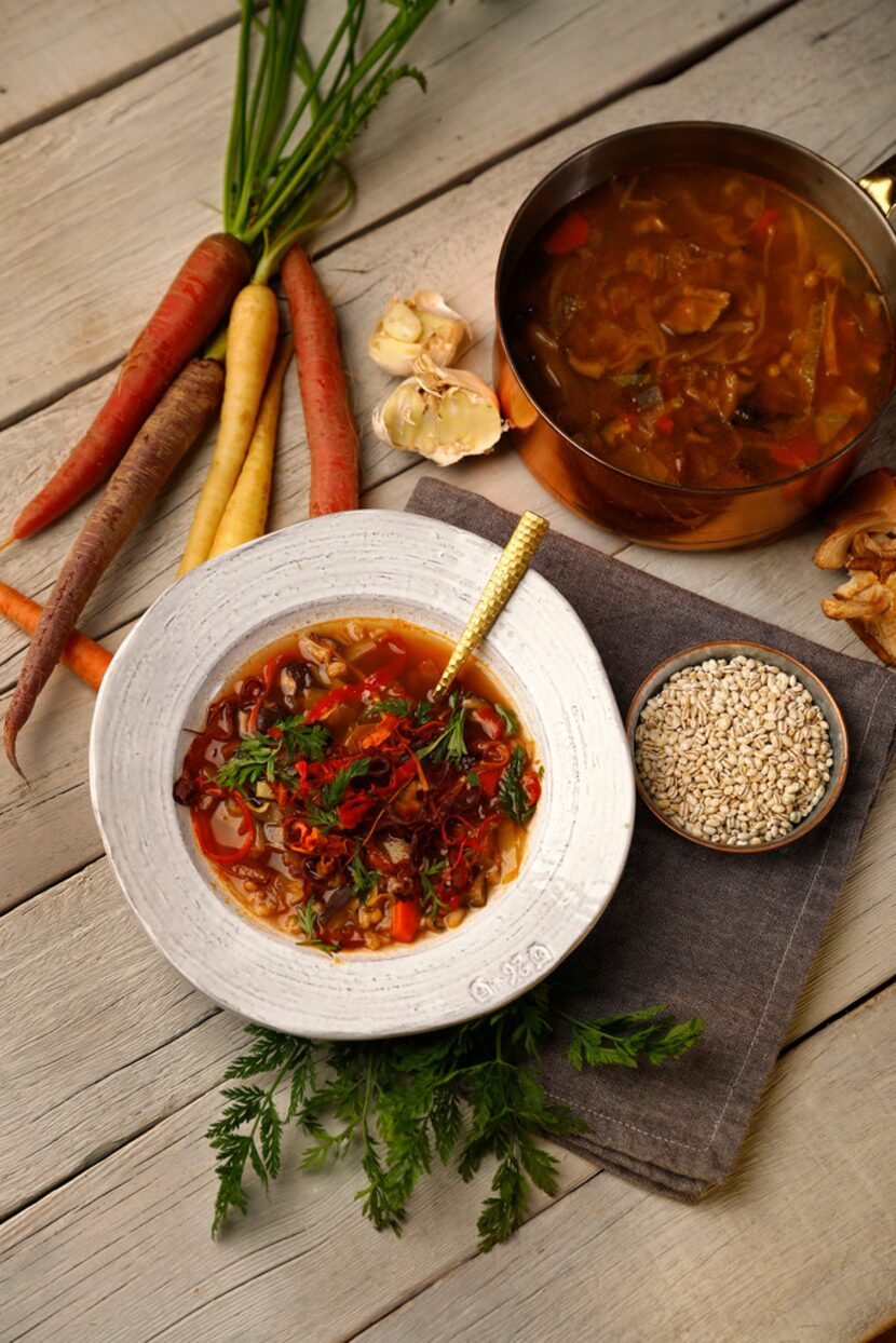 Vegetable barley and mushroom soup with carrot peel crisps