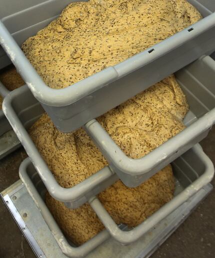 Bread dough sits in bins awaiting the next step in the process at Empire Baking Company in...