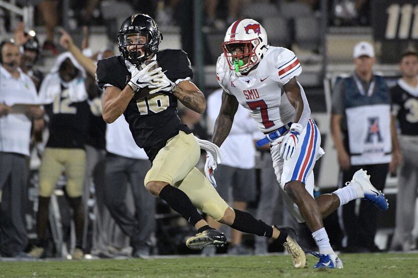 Central Florida wide receiver Tre Nixon (16) catches a pass in front of SMU cornerback...