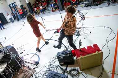Erin O'Neill and Steve Gooding of the band Gooding perform at Bussey Middle School in...