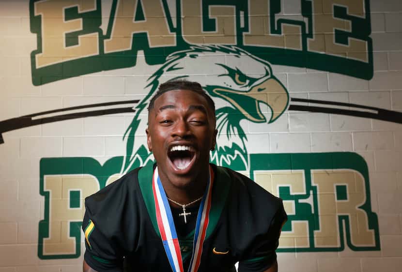 DeSoto High School wide receiver Johntay Cook II screams during a photoshoot at DeSoto High...