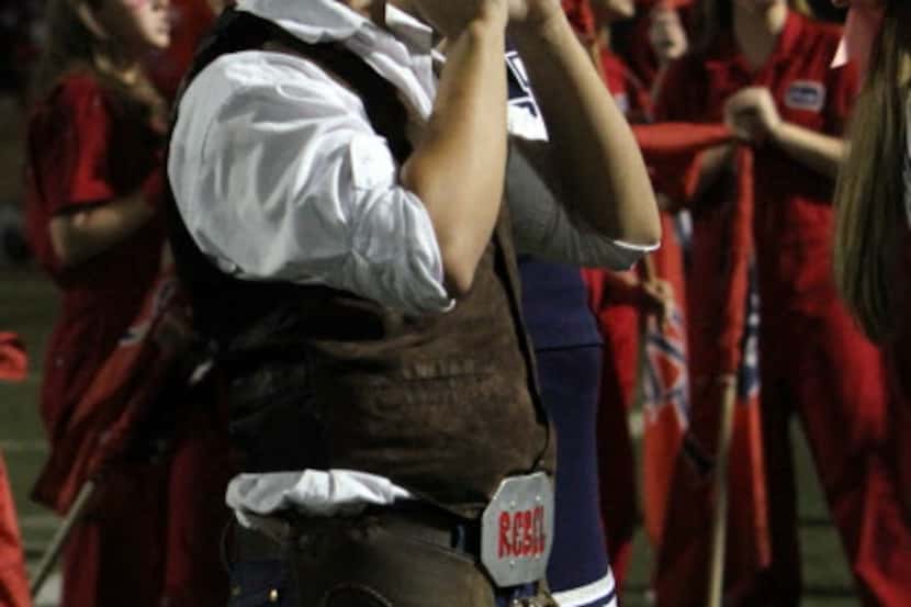 A student is dressed as "Rebel Man" during a 2014 game for Richland High School. Birdville...