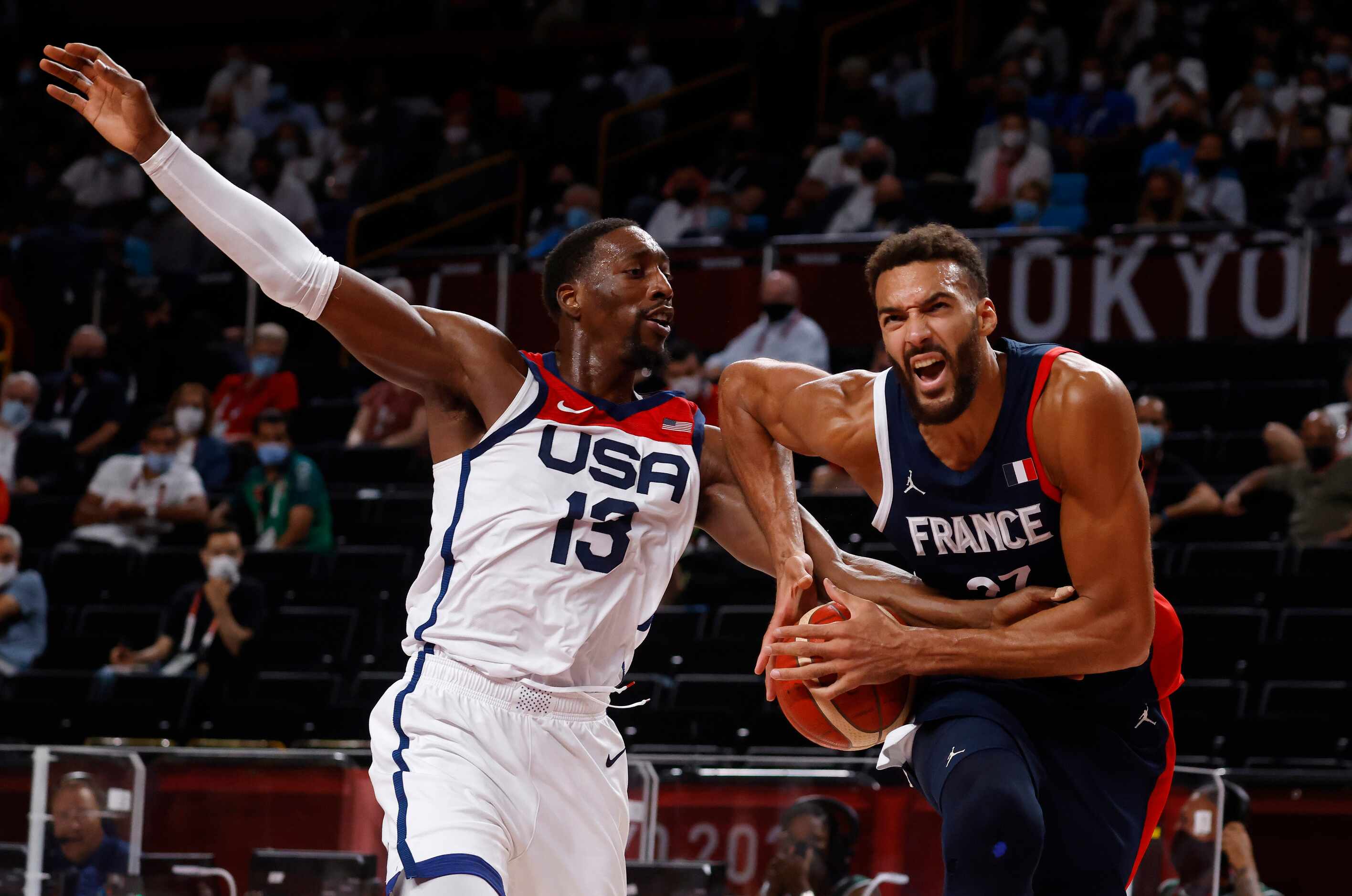 France’s Rudy Gobert (27) is fouled by USA’s Bam Adebayo (13) during the second half of play...