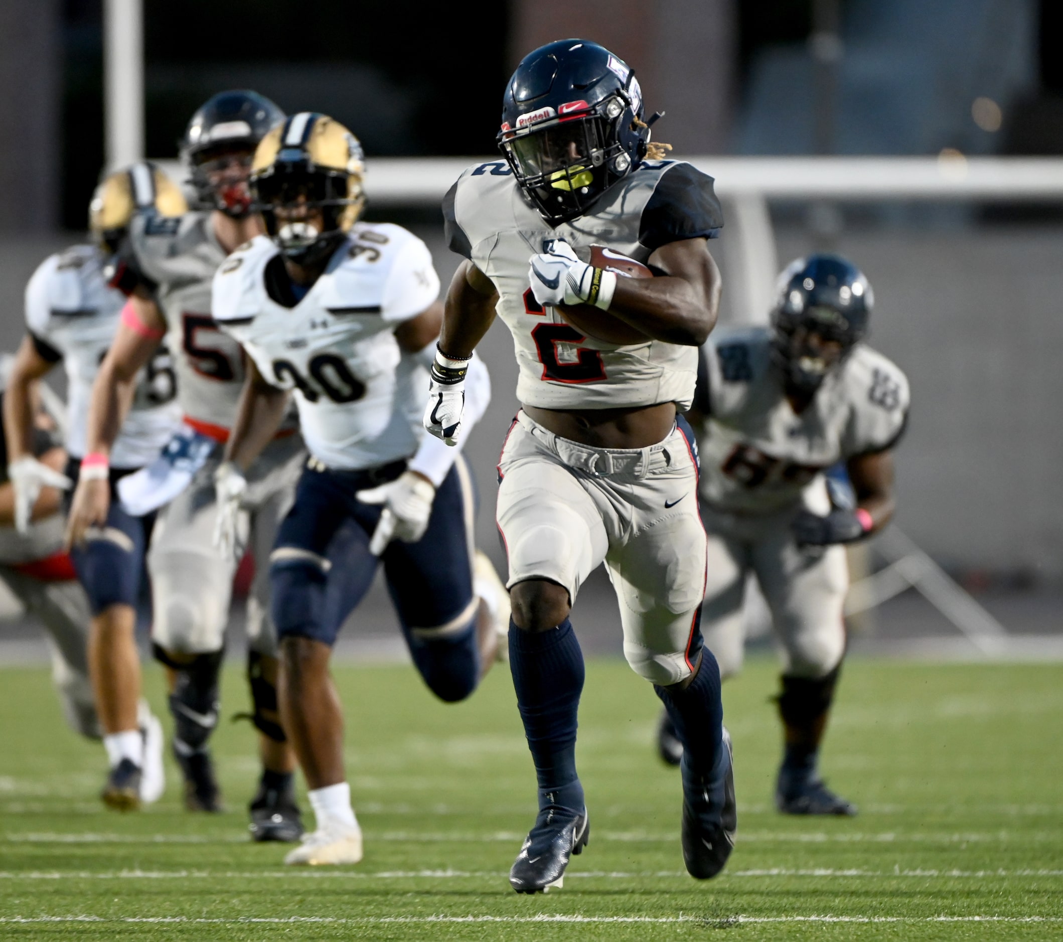 Allen’s Jaylen Jenkins (2) runs upfield for a touchdown in the first half of a high school...