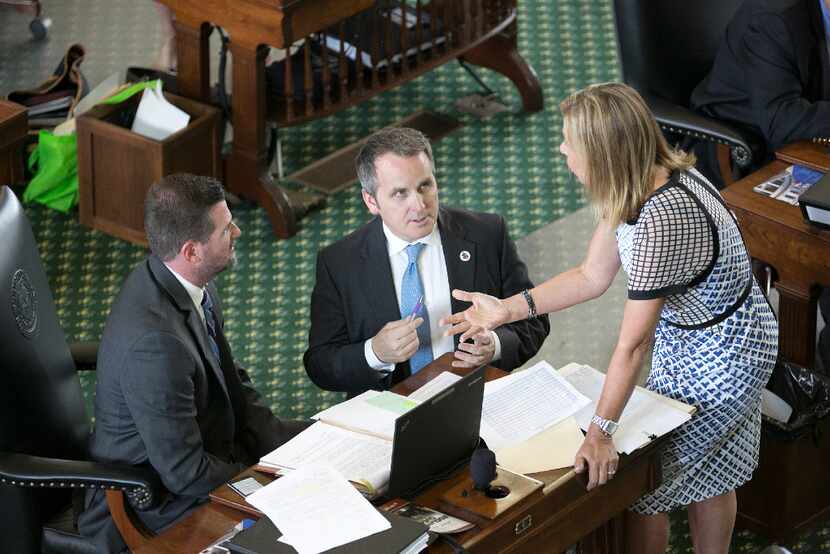 Sen. Bryan Hughes (center) briefly mounted a challenge to Straus while he was a...