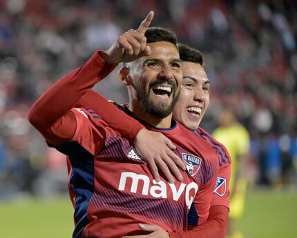 FC Dallas forward Franco Jara, left, and FC Dallas forward Alan Velasco celebrate after...