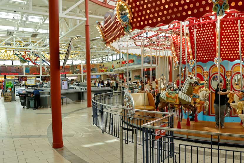 A carousel is near the food court at Stonebriar Centre. 