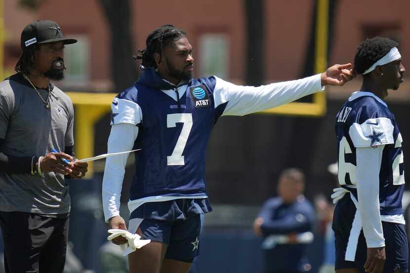 Dallas Cowboys cornerback Trevon Diggs (7) talks with defensive backs coach Al Harris and...