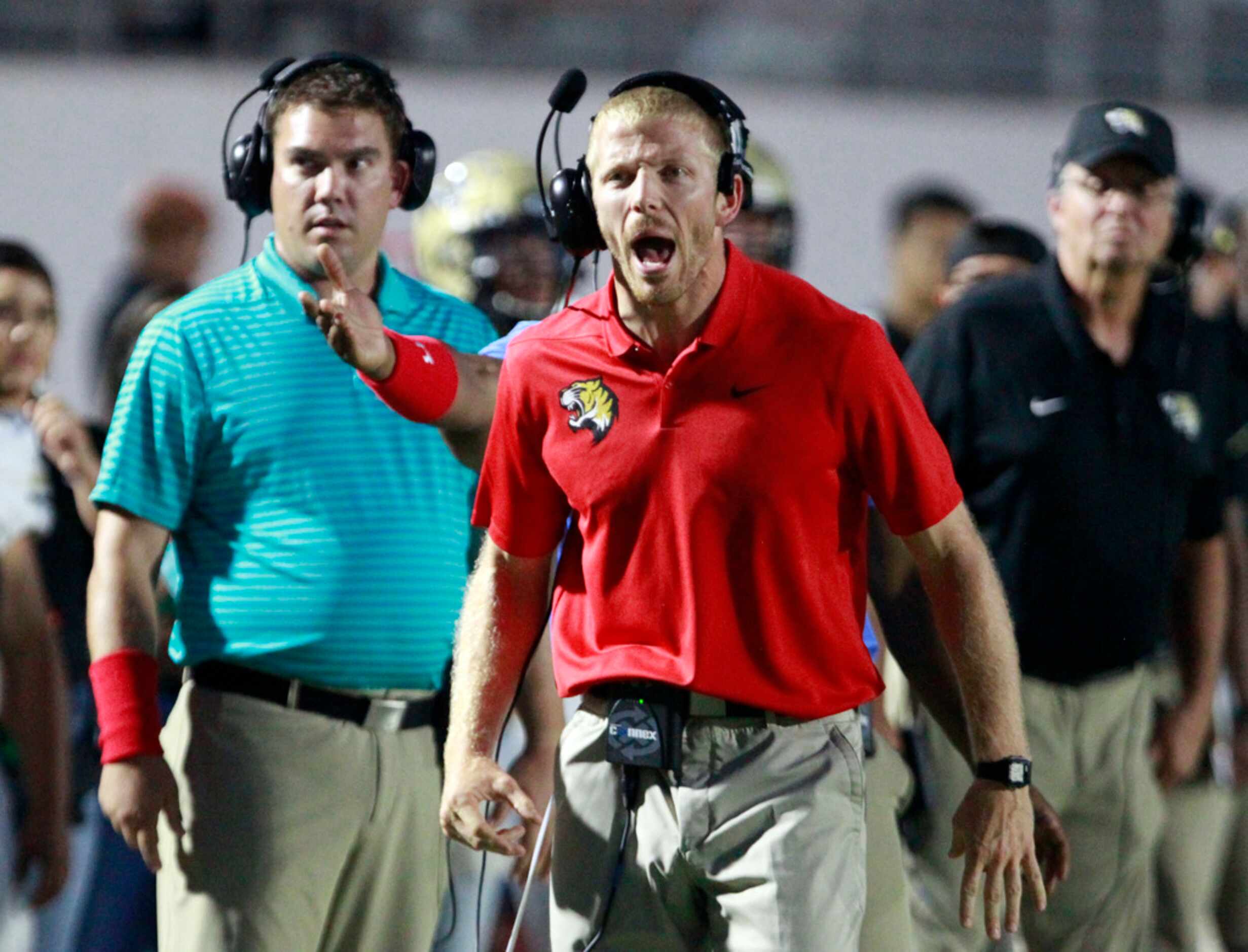 The Irving coaches watch, as Kimball makes another defensive stop on their  runner during...