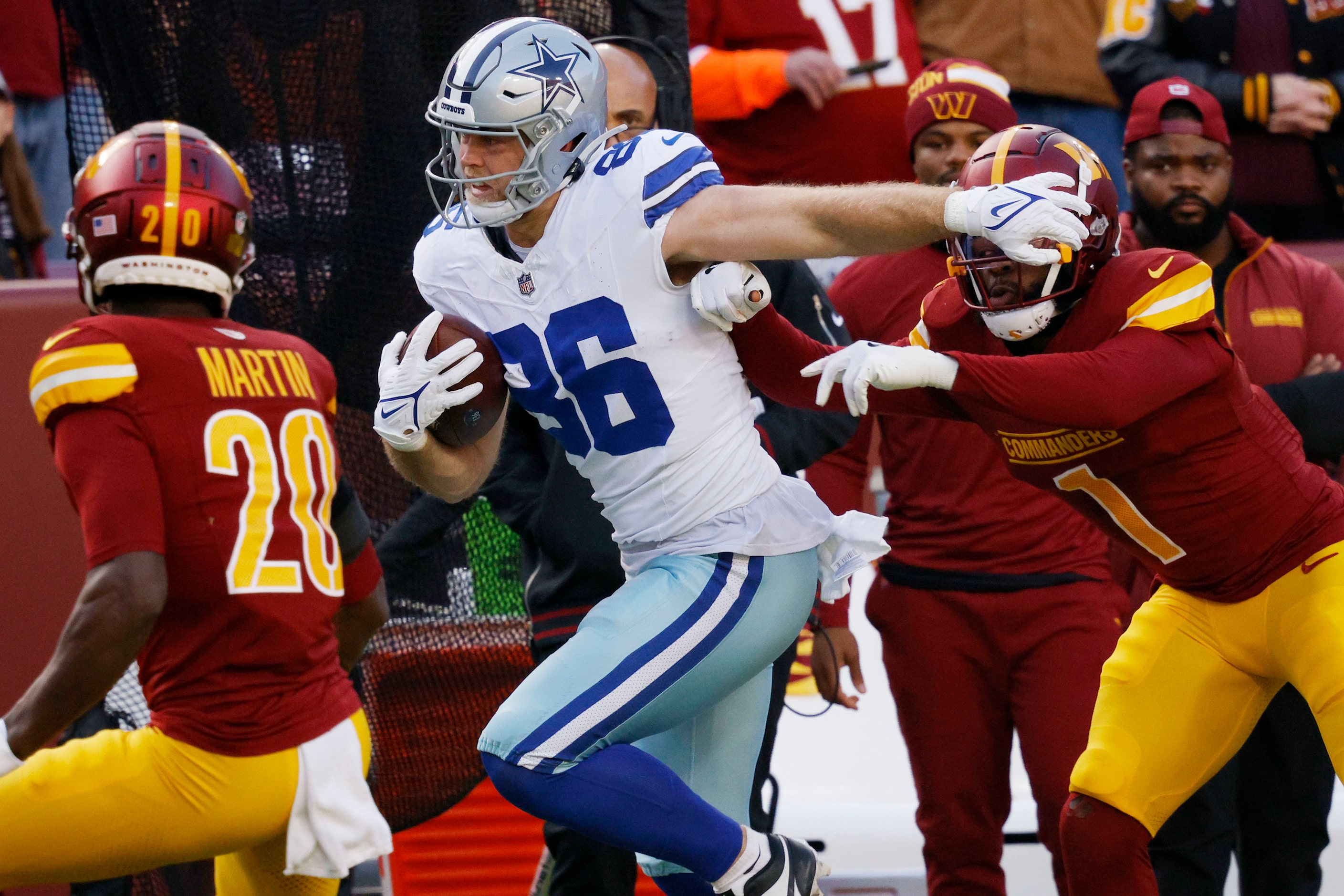 Dallas Cowboys tight end Luke Schoonmaker (86) carries the ball against Washington...