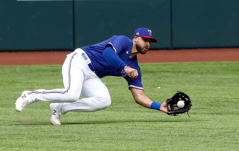 Texas Rangers center fielder Joey Gallo (13) makes a highlight catch making the fly out of...