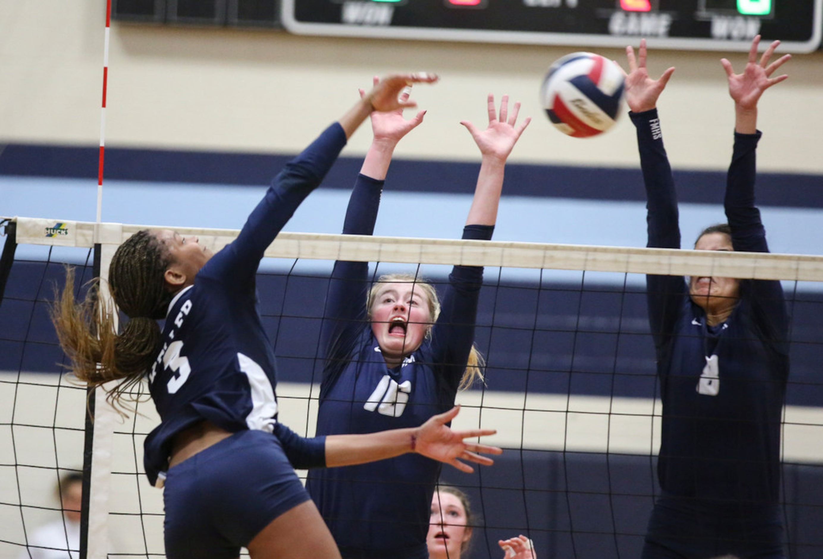 Caroline Dykes (4) of Flower Mound bumps the ball towards her teammate Bella Ortiz (8)...