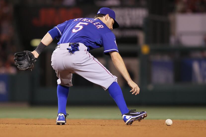 Ian Kinsler (5) of the Texas Rangers commits an error in the seventh inning against the Los...
