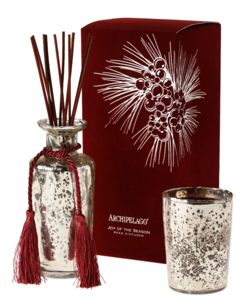 A bouquet of pine, bayberry and clove from Archipelago’s “Joy of the Season” candle and...