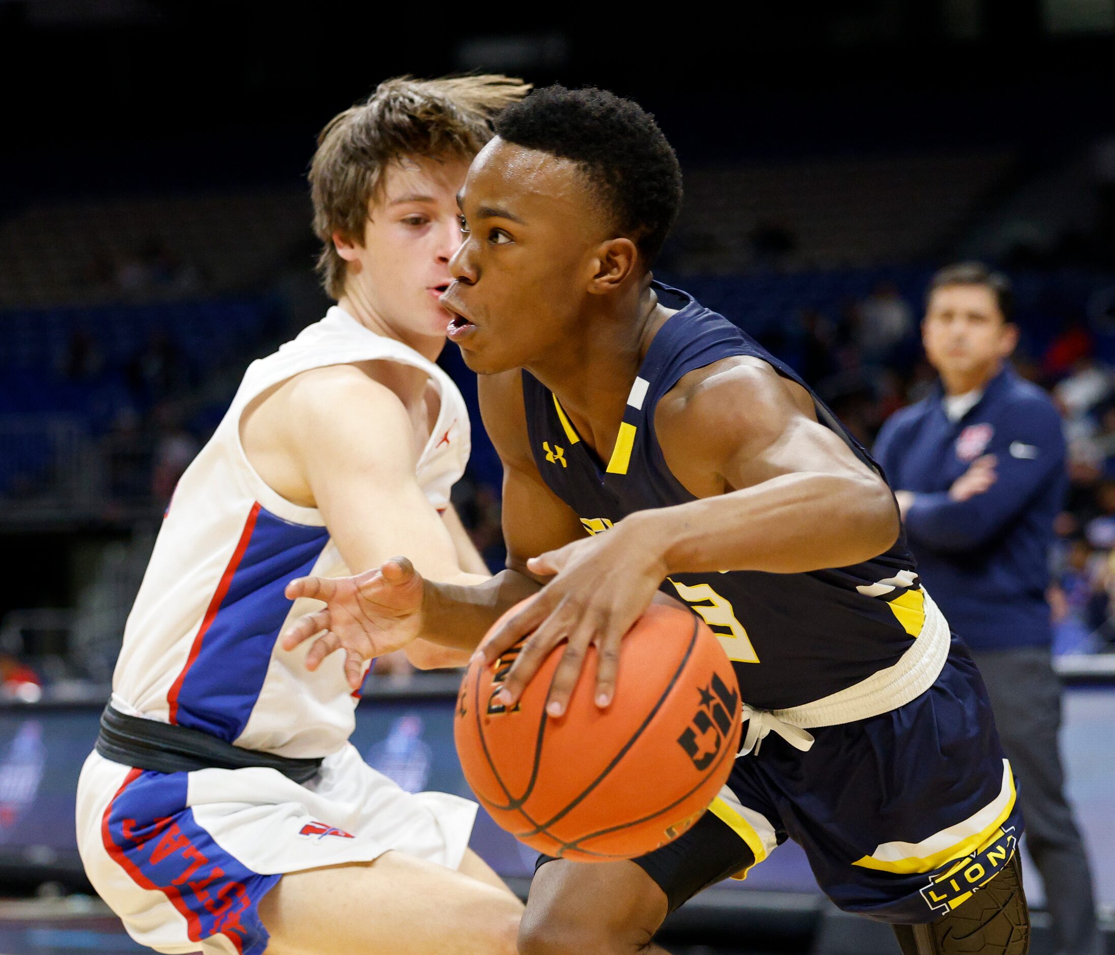 McKinney guard Jacovey Campbell (3) drives along the baseline past Austin Westlake guard...