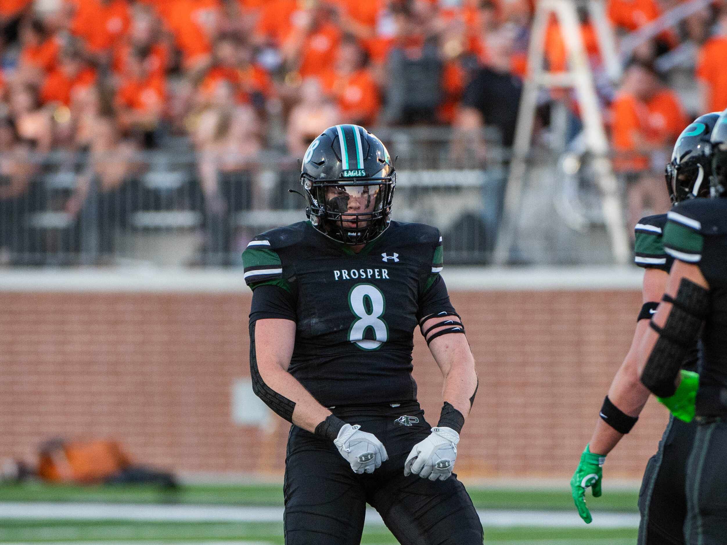 Prosper's Dylan Hinshaw (8) celebrates after a sack in the first half during a high school...