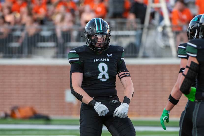 Prosper's Dylan Hinshaw (8) celebrates after a sack in the first half during a high school...