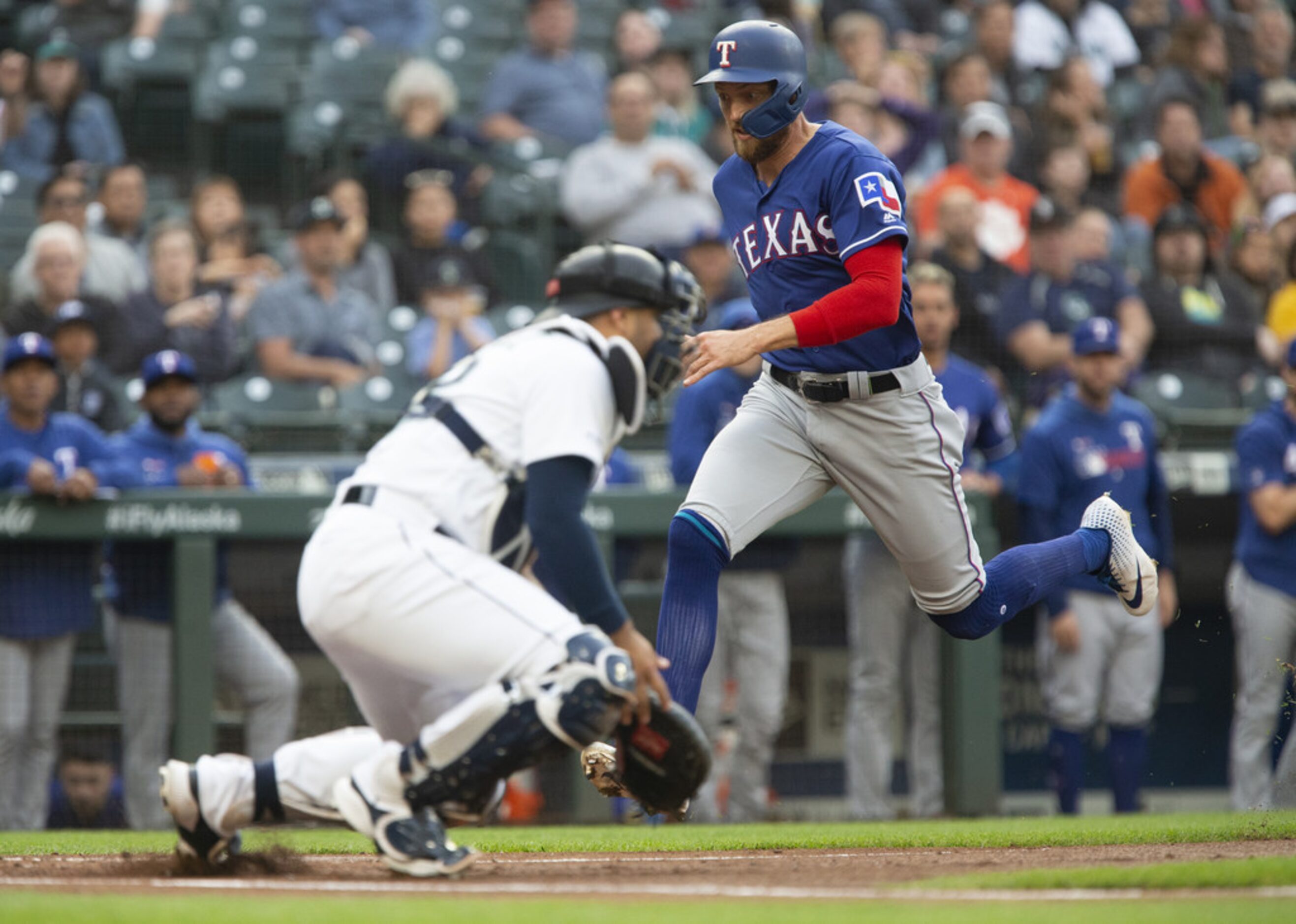 SEATTLE, WA - MAY 28:  Hunter Pence #24 of the Texas Rangers avoids Omar Narvaez #22 of the...