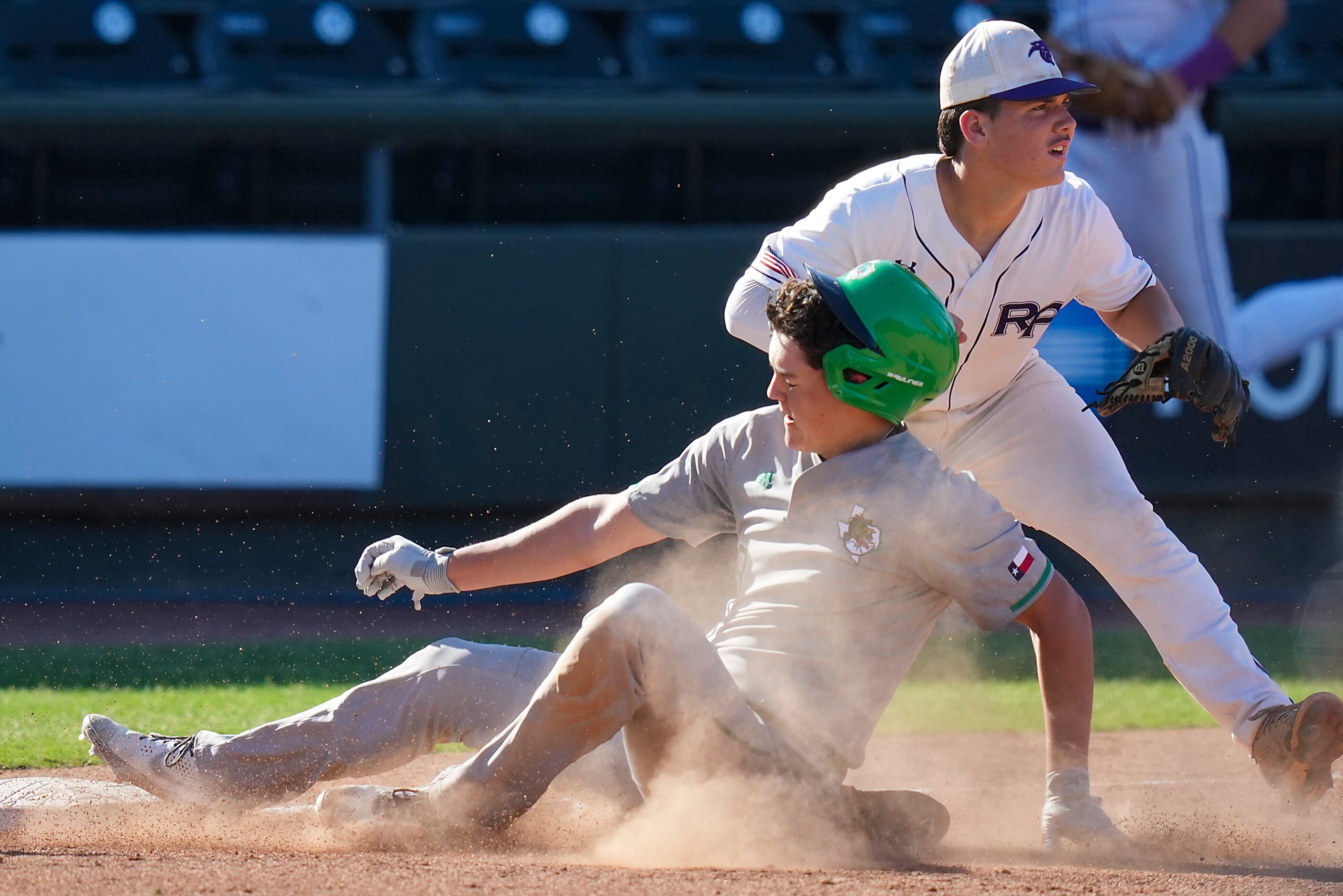 Southlake Carroll center fielder Owen Proksch (9) is safe at third base with a triple ahead...