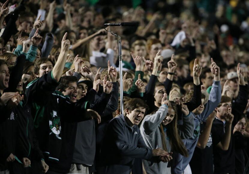 Southlake Carroll fans cheer in the first half during a 6A Division II Region 1 bi-district...