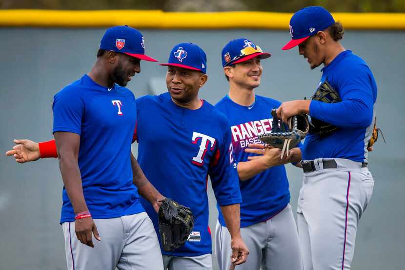 Texas Rangers infielder Jurickson Profar (left) talks with third base coach Tony Beasley as...