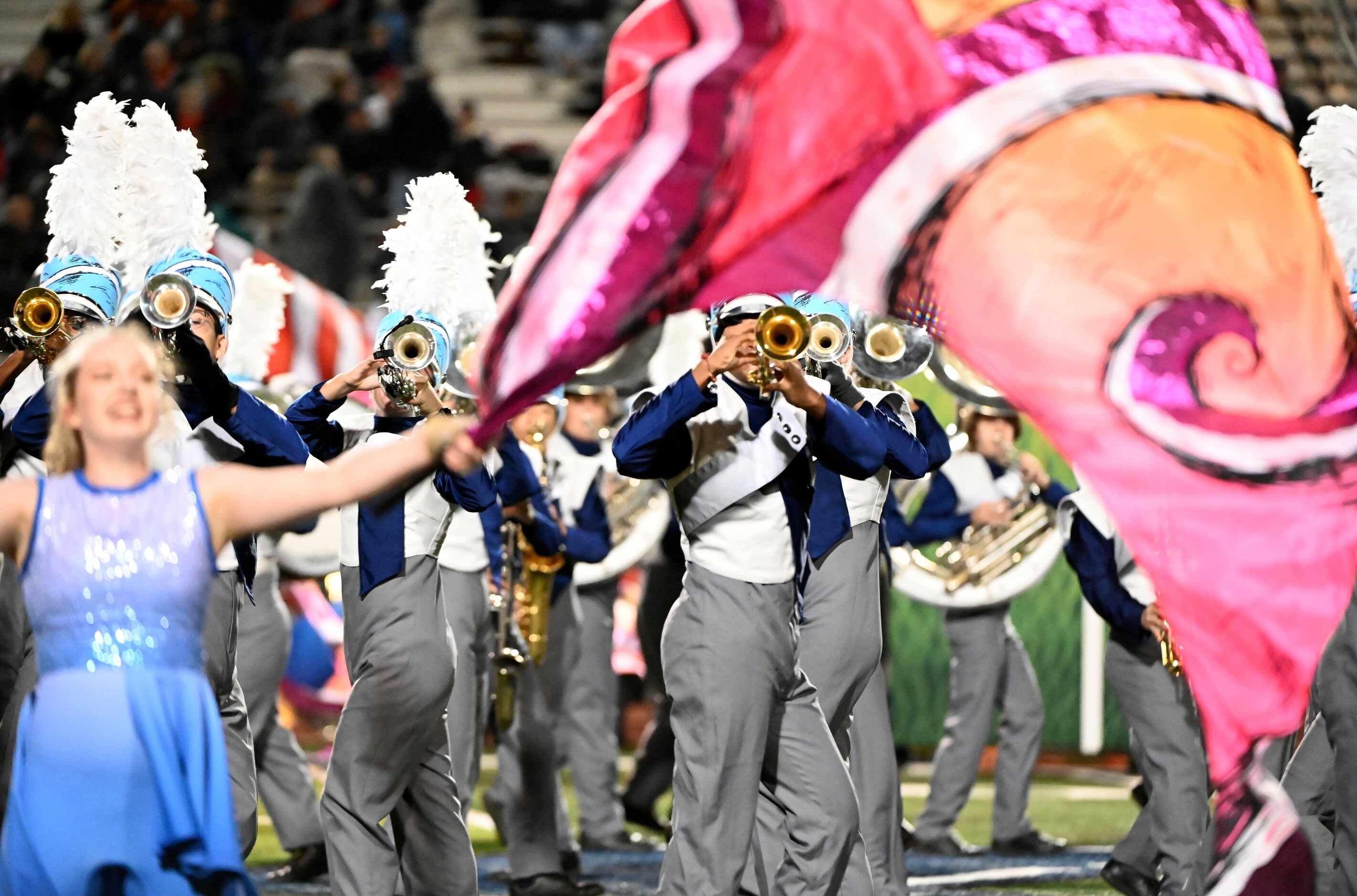 The Flower Mound band performs at halftime of a high school football game between Coppell...