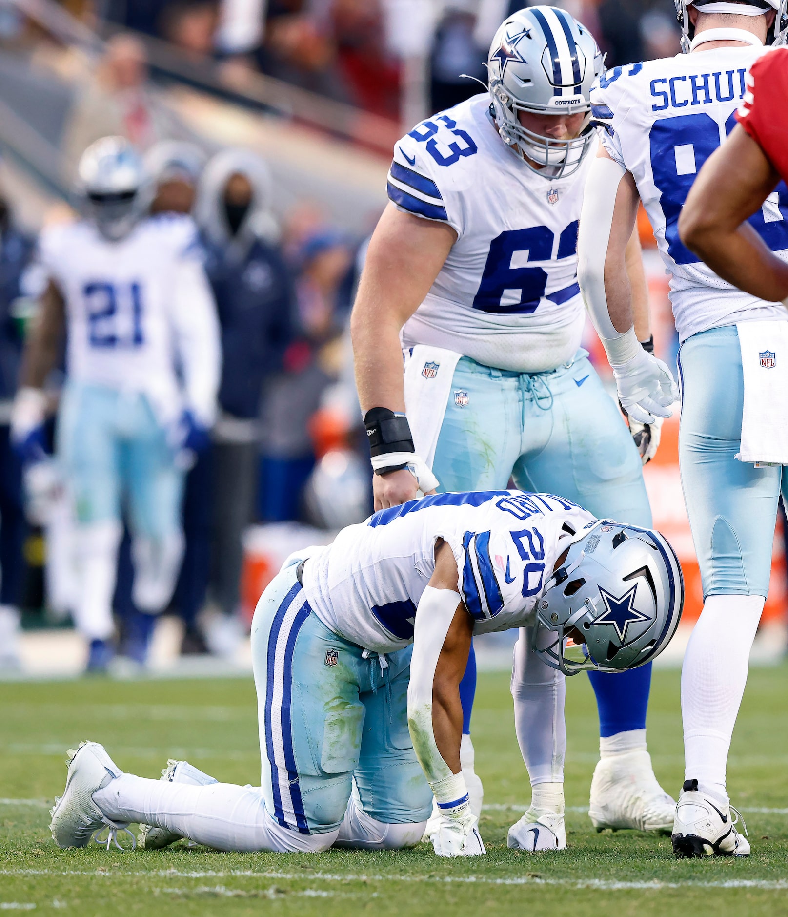 Dallas Cowboys running back Tony Pollard (20) is slow to get up in the second quarter after...