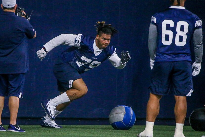 Dallas Cowboys defensive tackle Trysten Hill (79) runs through a drill during the Cowboys...