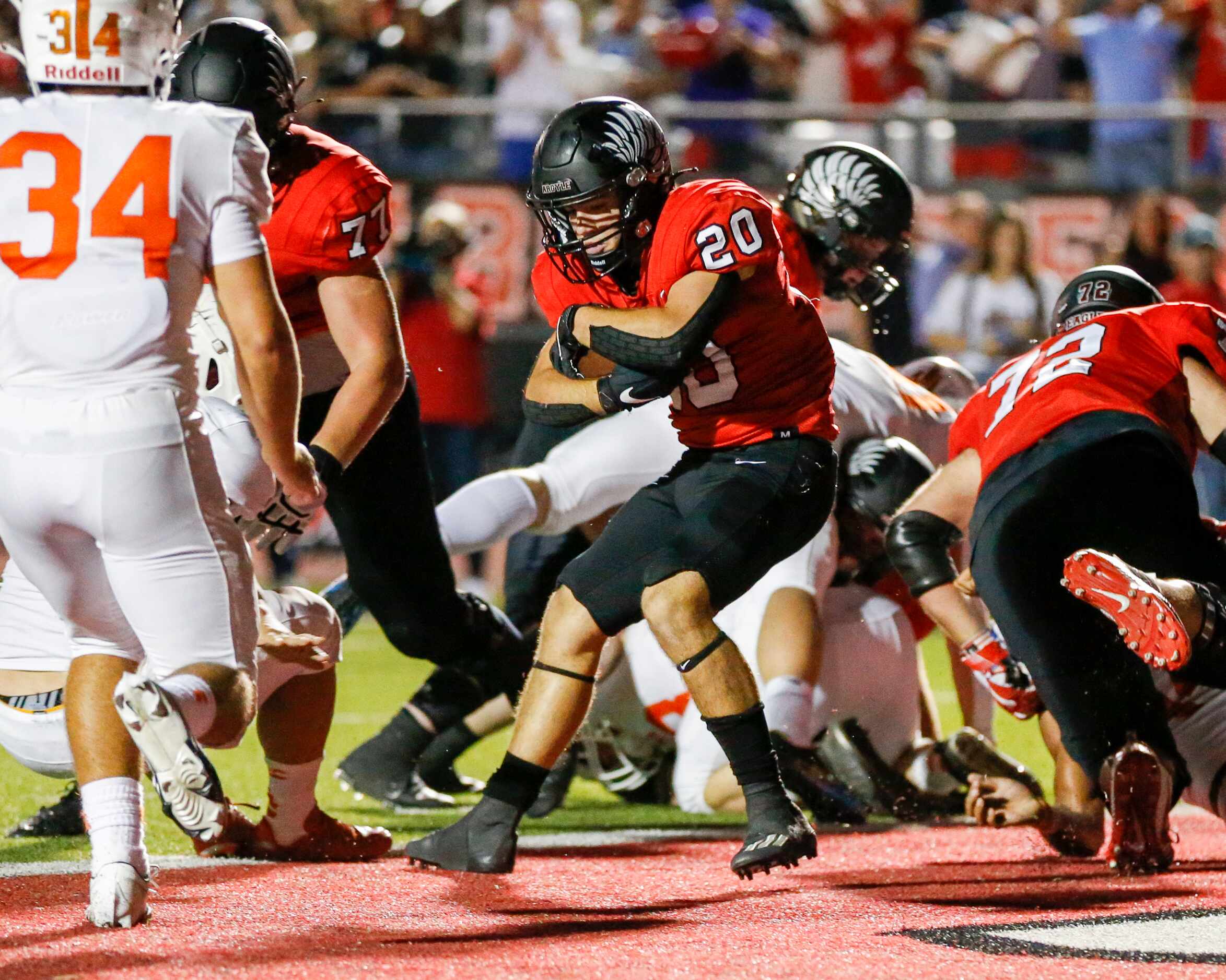 Argyle running back Landon Farris (20) spins into the end zone for a touchdown during the...