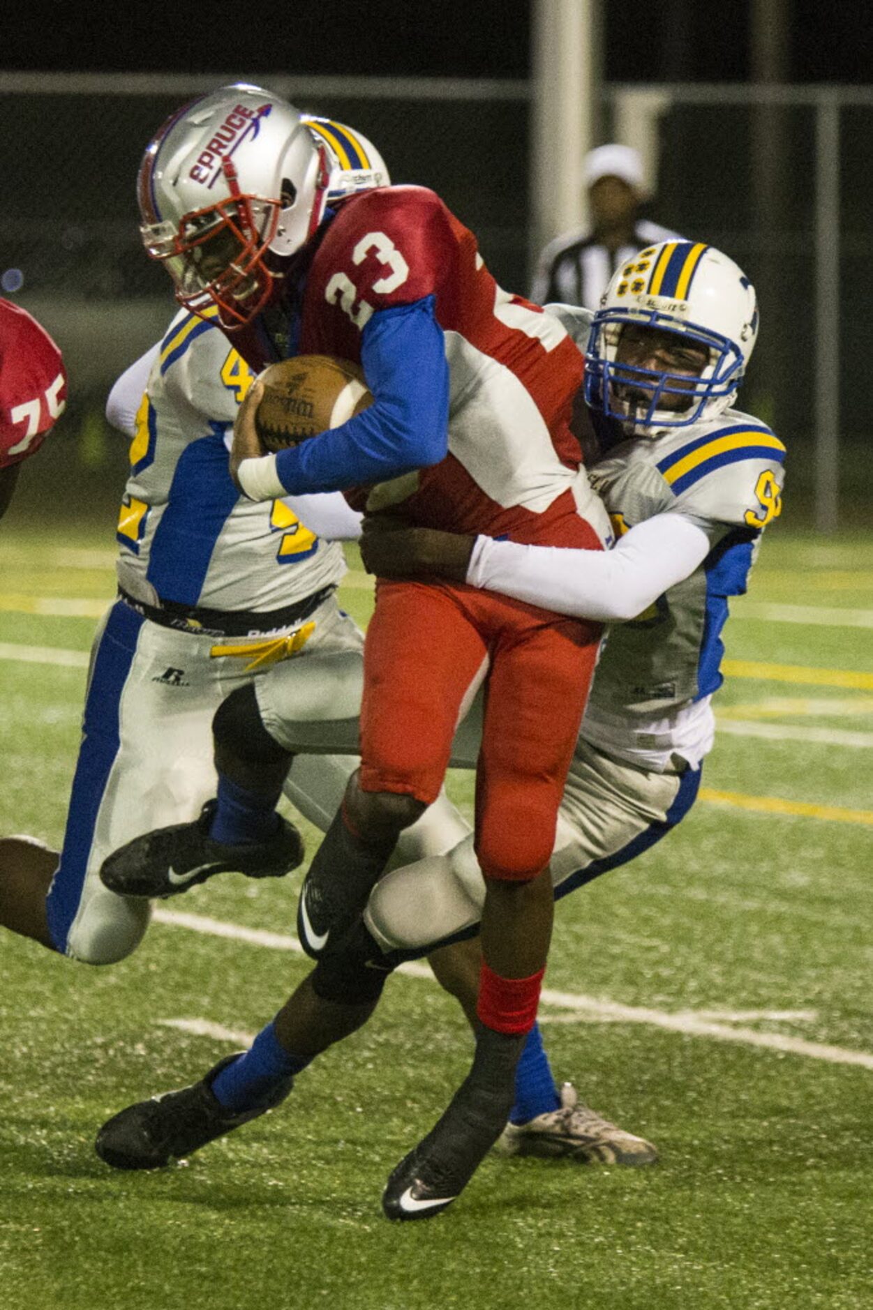 Samuell's Eric Cato (90) sacks Spruce's Travion Hardman (23) during W. W. Samuell's matchup...