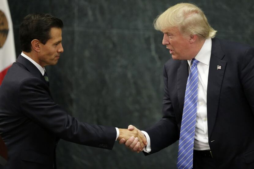 (FILES) This file photo taken on August 31, 2016 shows Mexican President Enrique Pena Nieto...