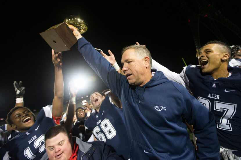 Allen head coach Terry Gambill celebrates his team after their 24-7 6A area round playoff...