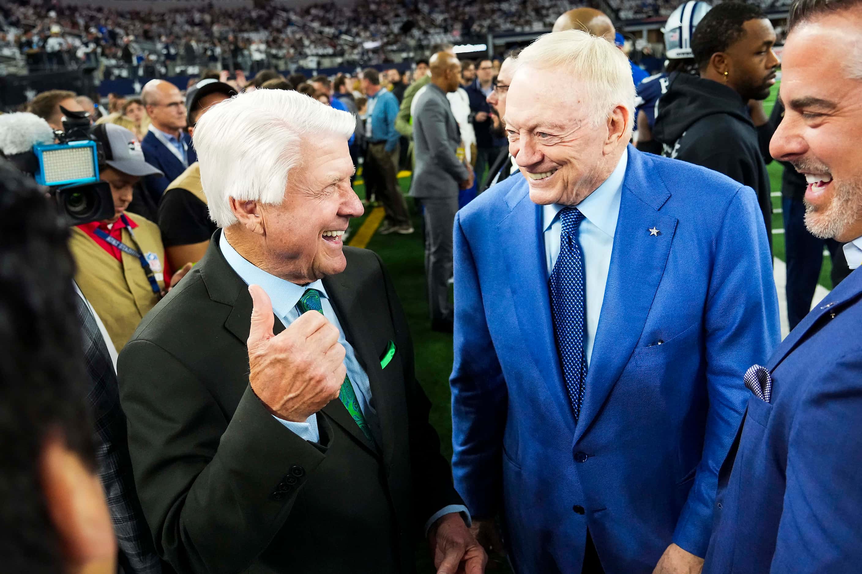 Former Dallas Cowboys coach Jimmy Johnson (left) laughs with with Cowboys owner Jerry Jones...