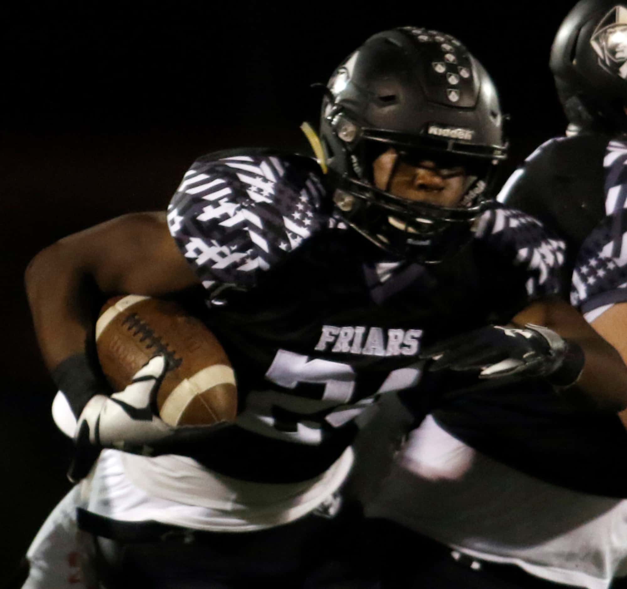 Bishop Lynch running back Darries Boyd (24) busts into the Parish Episcopal secondary during...