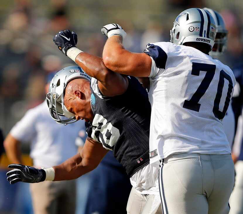 Dallas Cowboys defensive end Jack Crawford (58) loses his helmet as he is challenged in...