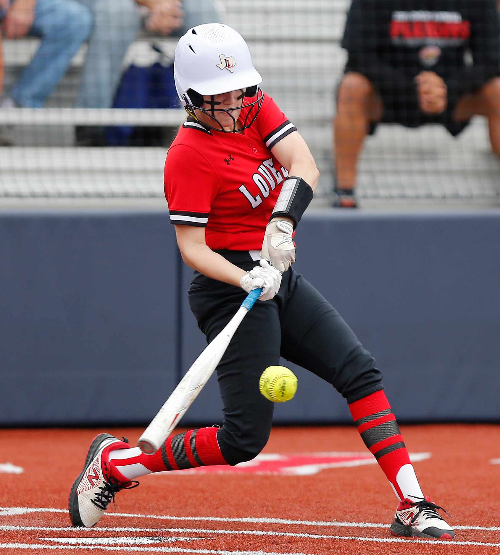 Lovejoy catcher Sydney Bardwell (3) makes contact in the third inning as Lovejoy High School...