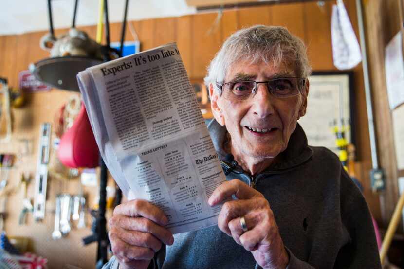 Norman Kantor, 90, poses for a portrait with the Texas Lottery numbers published in an issue...