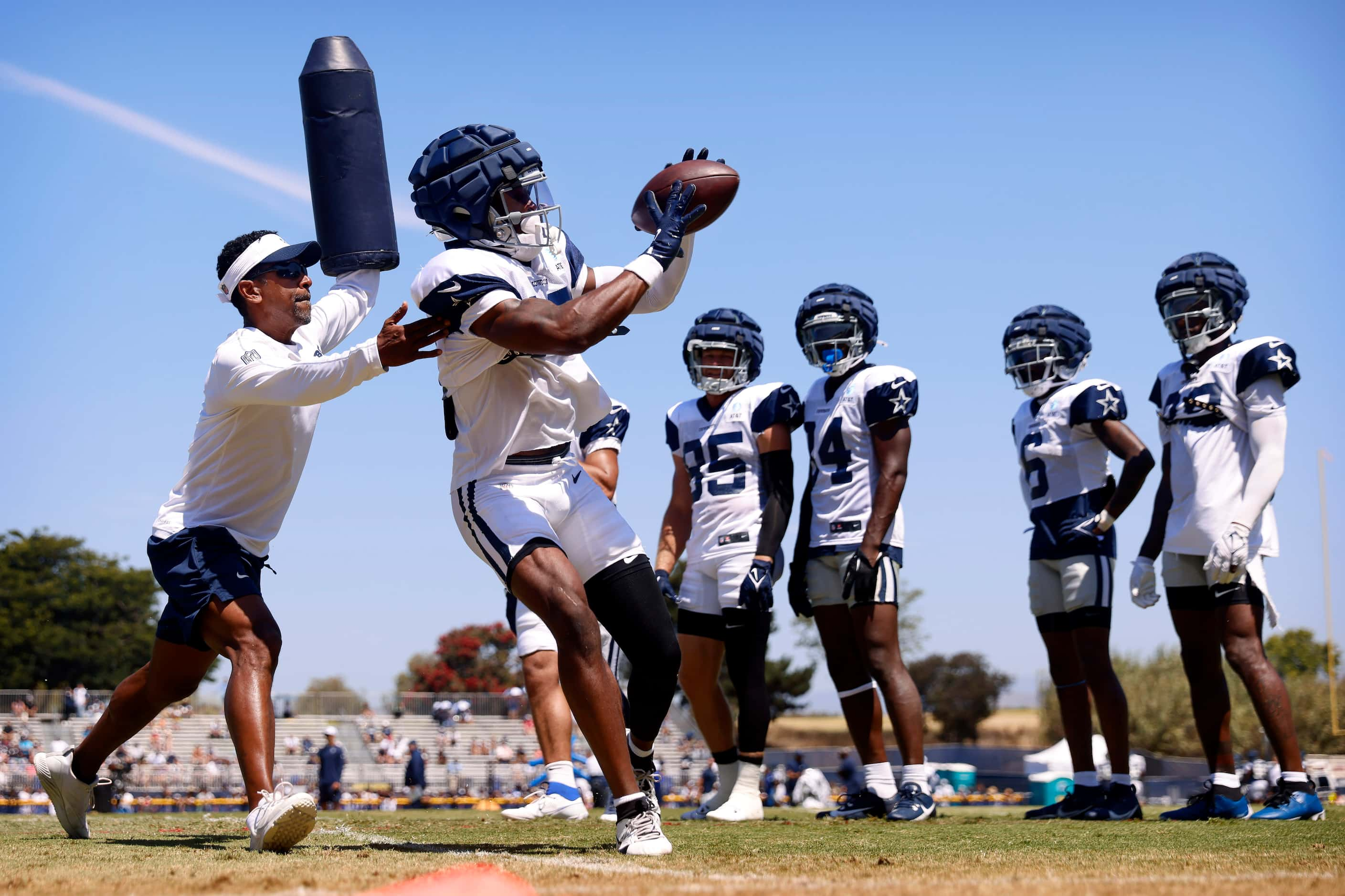 Dallas Cowboys wide receiver Ryan Floumoy (18) pulls in a pass along the sideline as he’s...