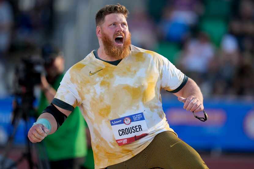 Ryan Crouser competes in the men's shot put final during the U.S. Track and Field Olympic...