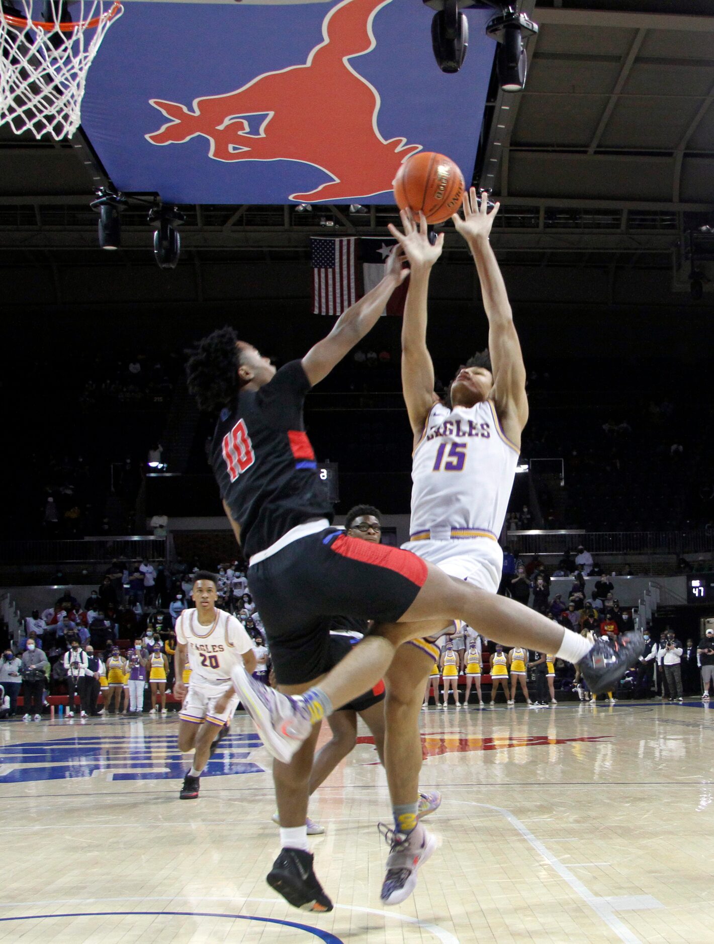 Richardson forward Lorenzo Pearson (15) is fouled by Duncanville guard Rasaun Collier (10)...