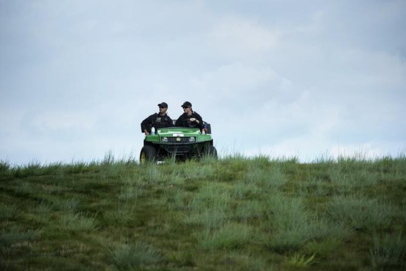 
Members of the Secret Service watched over TPC Potomac Golf Club while US President Barack...