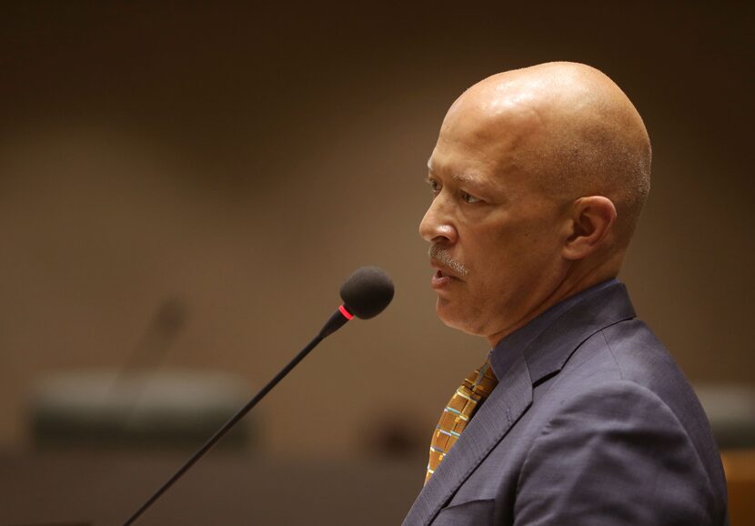 Dallas County District Attorney John Creuzot speaks to city council members about his police...