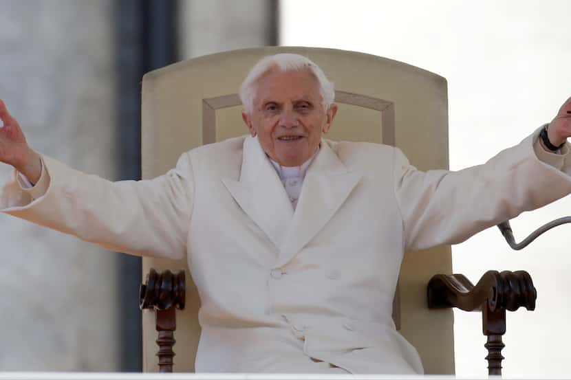 FILE - Pope Benedict XVI opens his arms during his final general audience in St. Peter's...