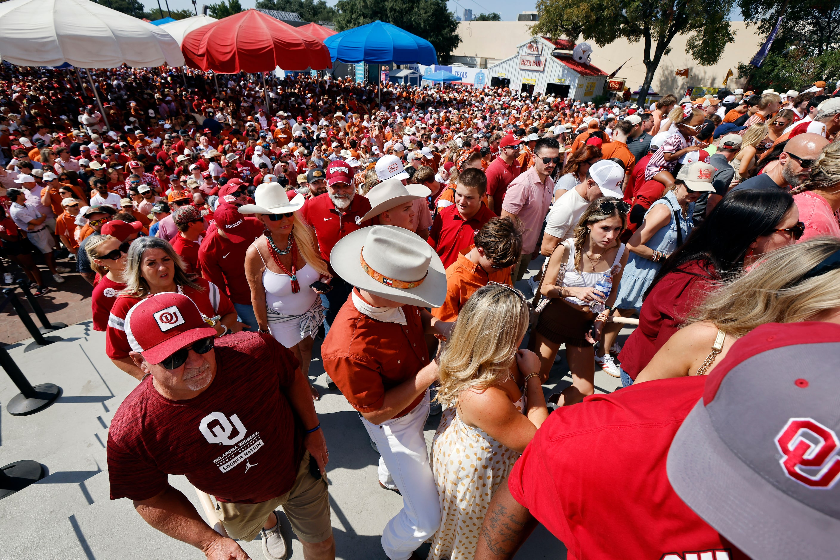 Texas Longhorns and Oklahoma Sooners fans arrive for the Red River Rivalry outside the...