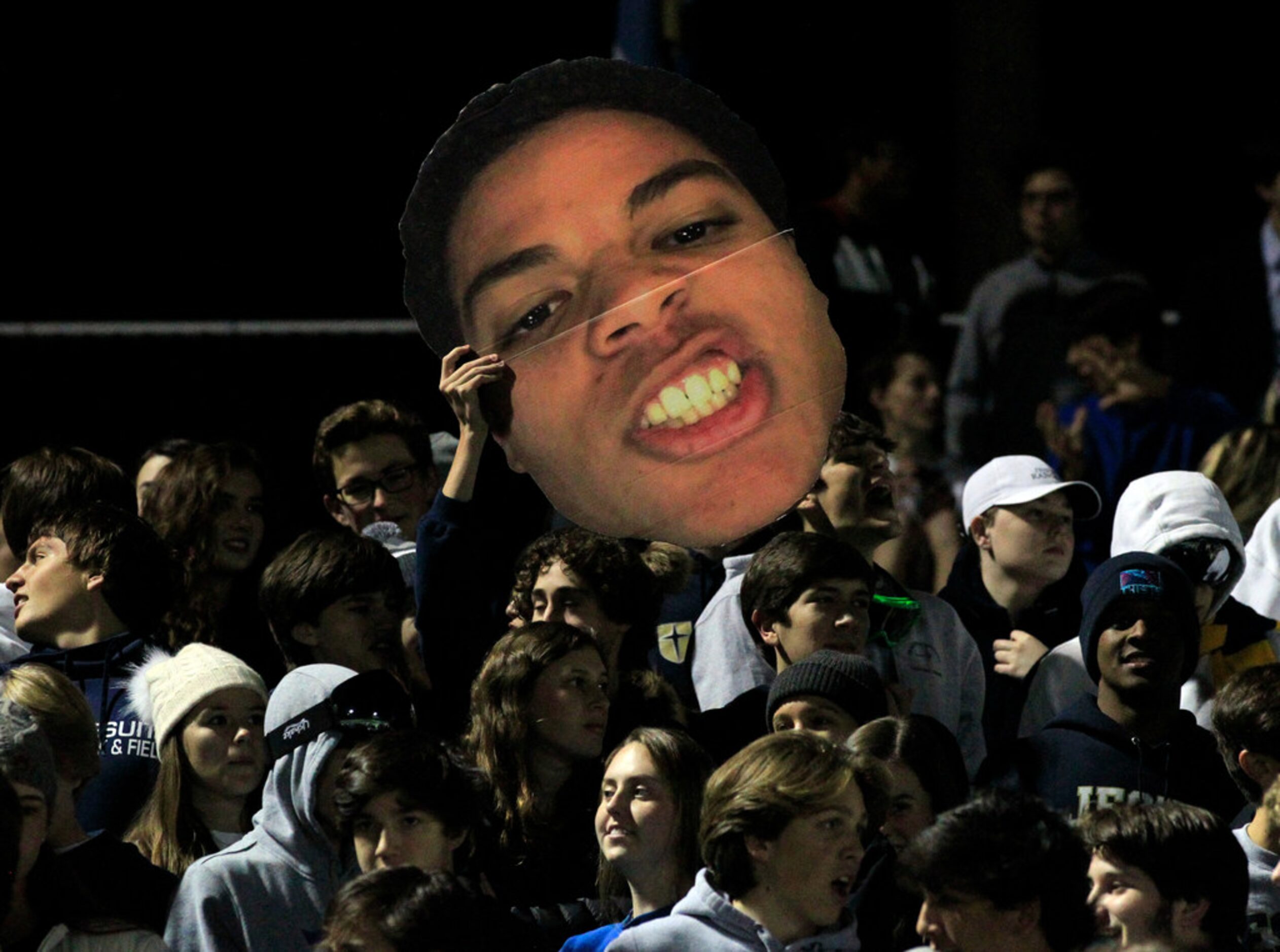 Jesuit fans hold up a big head sign during the first half of the Lakeview Centennial Vs....