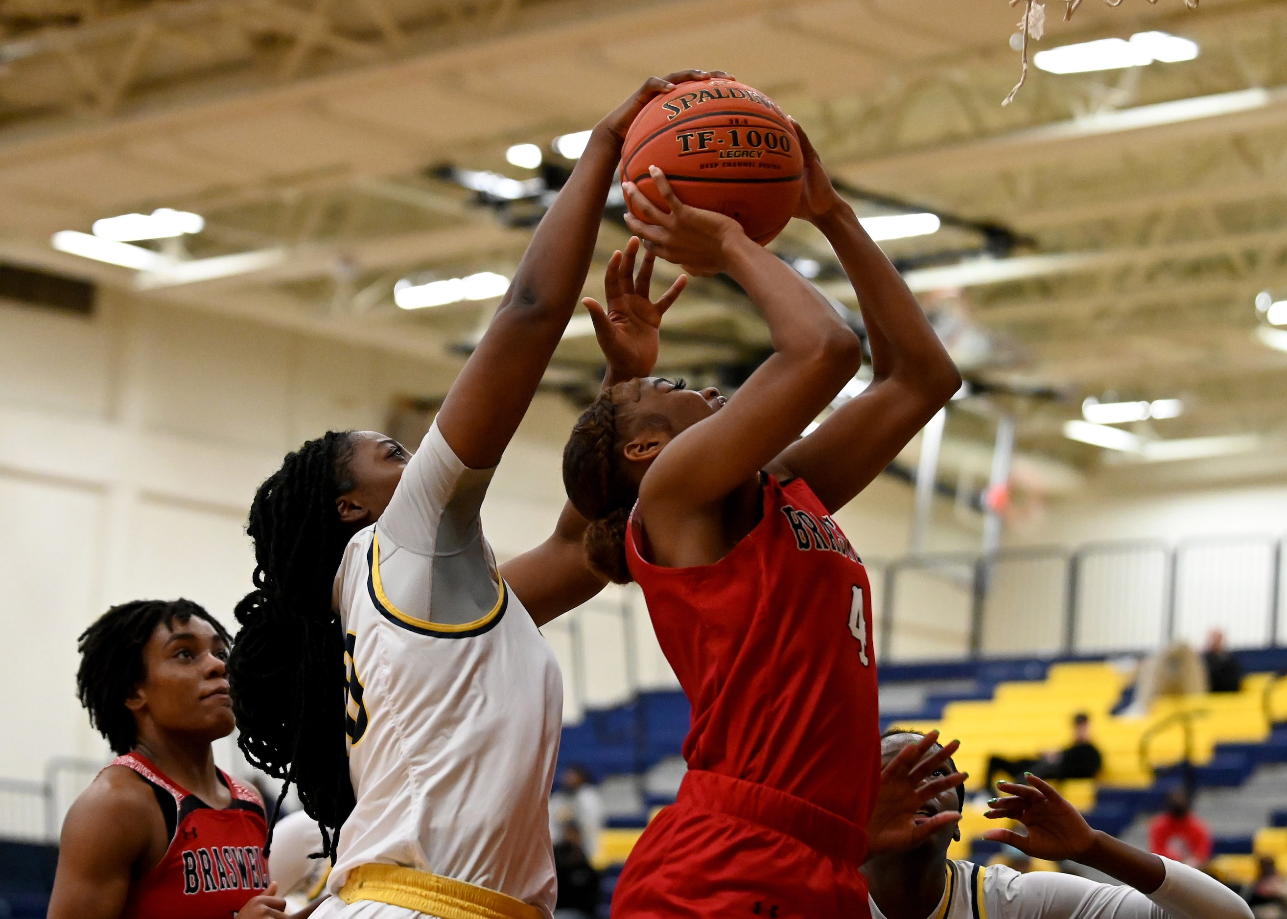 McKinney’s Kim Gordon (40) blocks a shot by Braswell’s Kennedy Evans (4) in the first half...